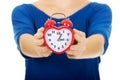 Young woman holding alarmclock. Royalty Free Stock Photo