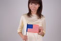 Young woman holding American Flag