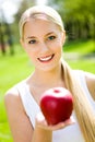 Young woman holding apple Royalty Free Stock Photo