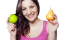 Young woman holding an apple and a pear Royalty Free Stock Photo