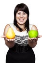 Young woman holding an apple and a pear Royalty Free Stock Photo