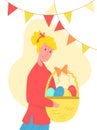Young woman holding basket of Easter eggs
