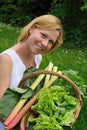 Young woman holding basket with vegetable Royalty Free Stock Photo