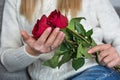 Embracing Love: Captivating Red Rose in Hands Royalty Free Stock Photo