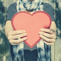 Young woman holding big red heart in her hands Royalty Free Stock Photo