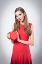 A young woman holding a big red heart Royalty Free Stock Photo