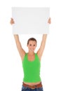 Young woman holding blank white sign Royalty Free Stock Photo
