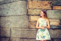 Young woman holding book, thinking outdoors in New York City Royalty Free Stock Photo