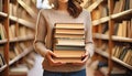 Young Woman Holding Books In Library Royalty Free Stock Photo