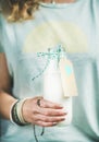 Young woman holding bottle of dairy-free almond milk Royalty Free Stock Photo