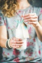 Young woman holding bottle of dairy-free almond milk Royalty Free Stock Photo