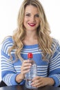 Young Woman Holding Bottle of Mineral Water Royalty Free Stock Photo