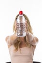 Young Woman Holding a Bottle of Mineral Water Royalty Free Stock Photo