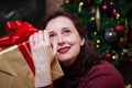 Young woman holding a box with a New Year gift Royalty Free Stock Photo