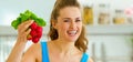 Young woman holding bunch of radishes Royalty Free Stock Photo