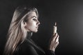 Young woman holding a candle in a smoke Royalty Free Stock Photo