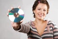 Young woman holding CD disk Royalty Free Stock Photo