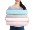 Young woman holding clean towels on white background Royalty Free Stock Photo