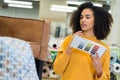 young woman holding color guide for fabric Royalty Free Stock Photo