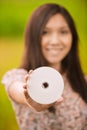 Young woman holding compact-disk Royalty Free Stock Photo