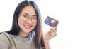 Young woman holding credit card. Asia smiling woman with credit card in hand, Happy to have money concept. Online shopping Royalty Free Stock Photo