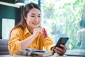 Young woman holding credit card and using laptop computer. Businesswoman working at cafe. Online shopping, e-commerce, internet Royalty Free Stock Photo