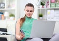 Young woman holding credit card and using laptop computer. Online shopping concept Royalty Free Stock Photo