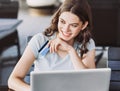 Young woman holding credit card and using laptop computer. Online shopping concept Royalty Free Stock Photo