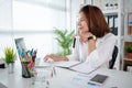 Young woman holding credit card and using a laptop computer to order online. Online shopping concept Royalty Free Stock Photo