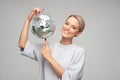 young woman holding a disco ball Royalty Free Stock Photo