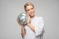 magic shimmering young woman holding a disco ball Royalty Free Stock Photo