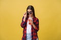Young woman holding and drinking cold drink beverage in casual clothes. pretty girl smiling happy laughing looking at Royalty Free Stock Photo