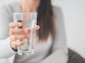 Young woman holding drinking water glass in her hand. Royalty Free Stock Photo