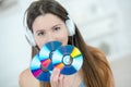 Young woman holding dvd-rom Royalty Free Stock Photo