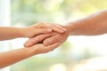 Young woman holding elderly man hand Royalty Free Stock Photo