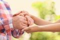 Young woman holding elderly man hands Royalty Free Stock Photo