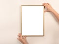 Young woman holding empty picture frame with copyspace in an upright position Royalty Free Stock Photo