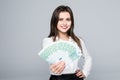 Young woman holding euro money isolated on white background Royalty Free Stock Photo