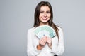 Young woman holding euro money isolated on white background Royalty Free Stock Photo