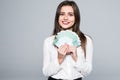 Young woman holding euro money isolated on white background Royalty Free Stock Photo