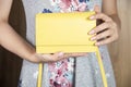 Woman holding yellow bag Royalty Free Stock Photo