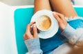 Young woman holding in female hands and drink hot aroma cup of coffee cuppuccino in breakfast time, hipster traveler girl in the m Royalty Free Stock Photo