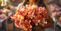 A young woman is holding a festive bouquet in her hands