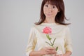 Young woman holding flower Royalty Free Stock Photo