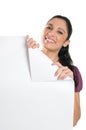 Young woman holding folded corner signboard Royalty Free Stock Photo