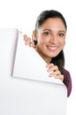 Young woman holding folded corner signboard