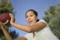 Young Woman Holding Football