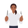 Young woman holding fork and knife. Hungry woman waiting for food Royalty Free Stock Photo