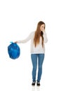 Young woman holding a full garbage bag. Royalty Free Stock Photo