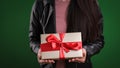 Young woman holding a gift box in her hands Royalty Free Stock Photo